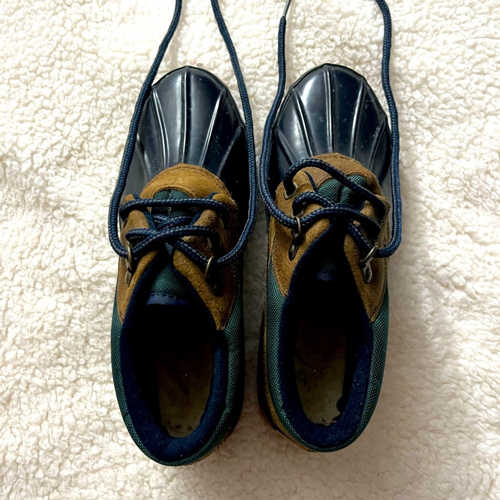 A size 6 green, black and cream snow/rain boots